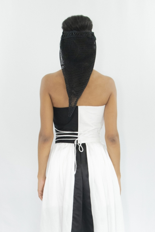Woman wearing black & white cotton and linen zero waste contrasting front laced corset
